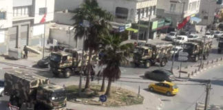 حقيقة الشاحنات العسكرية المُنتشرة في العوينة